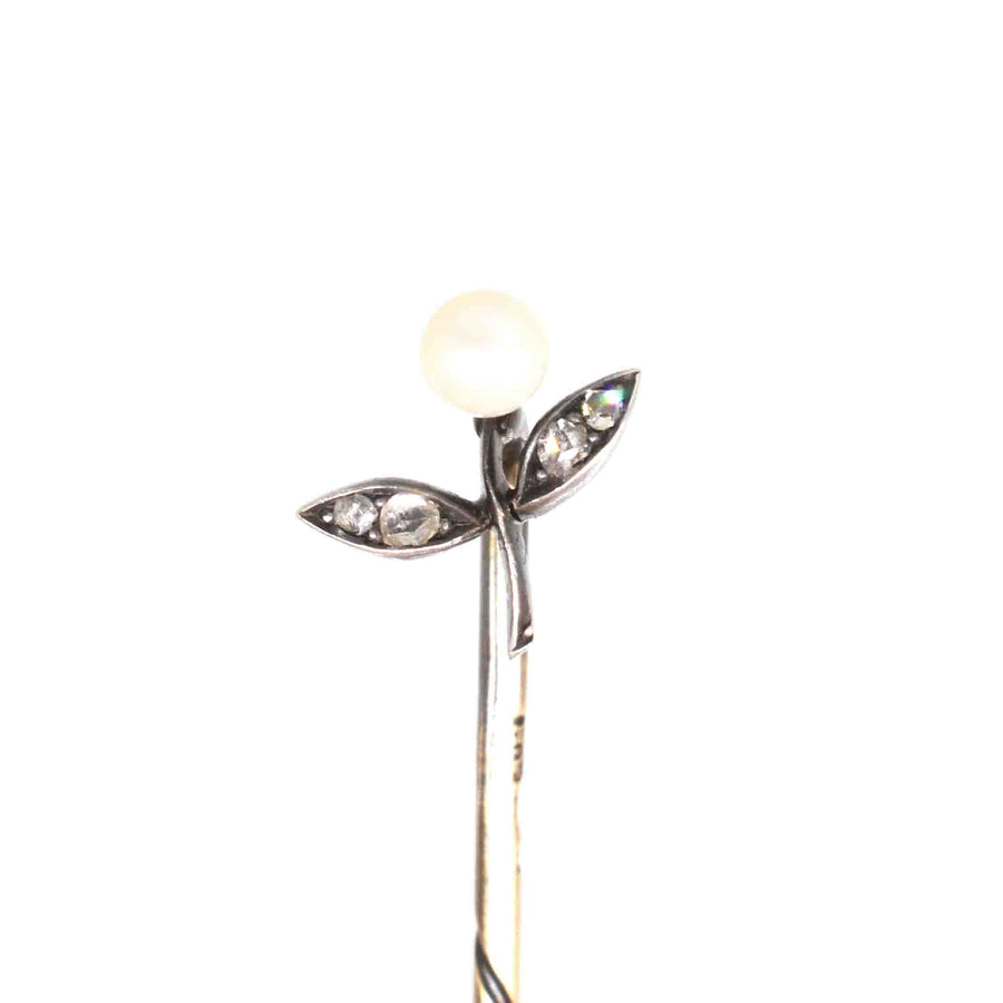 Austro-Hungarian 14ct gold tie pin featuring a pearl flower and rose-cut diamond leaves in a floral design.