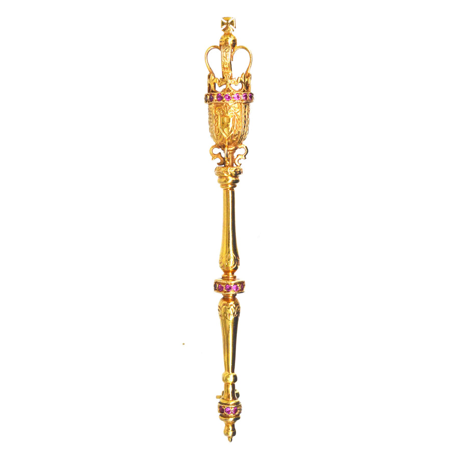 Vintage 9ct Gold Royal Mace Brooch featuring rubies, symbolizing British authority and tradition.