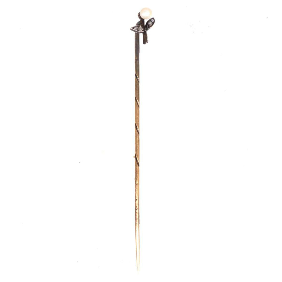 Austro-Hungarian 14ct gold tie pin featuring a floral design, pearl flower head, and rose-cut diamond leaves.