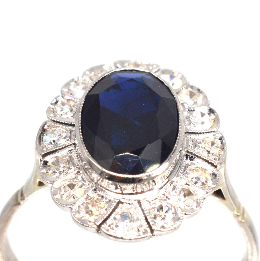 Early 20th Century Dark Blue Sapphire and Diamond Cluster Ring