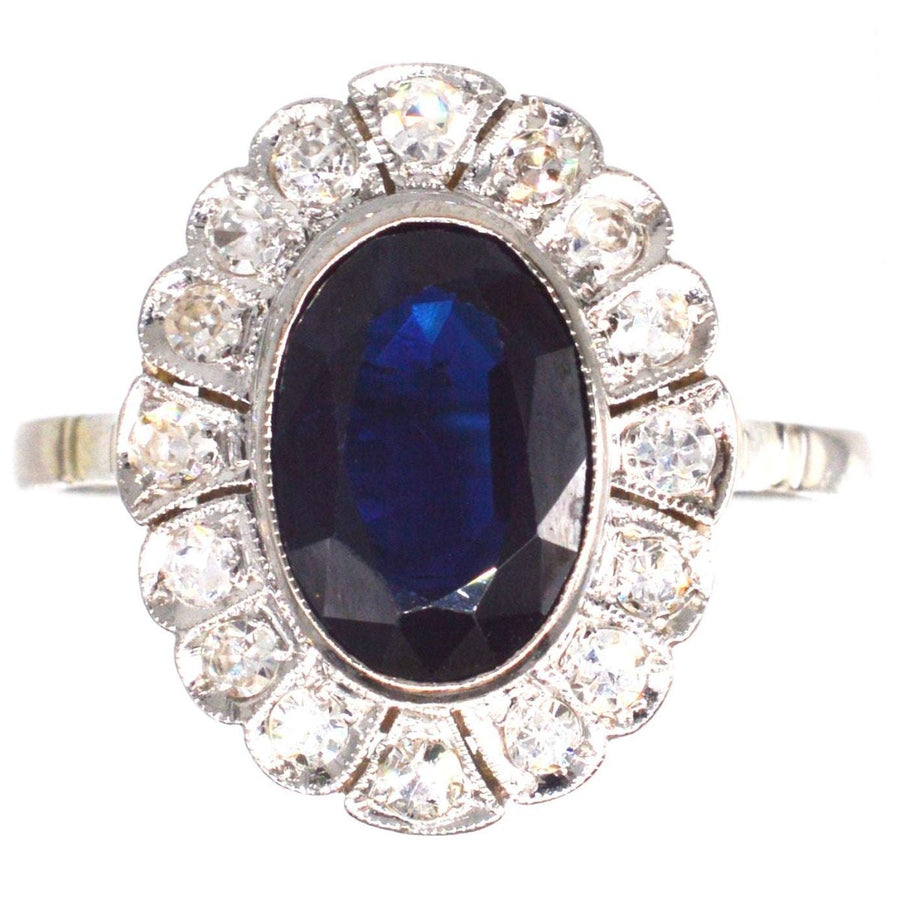 Early 20th Century Dark Blue Sapphire and Diamond Cluster Ring