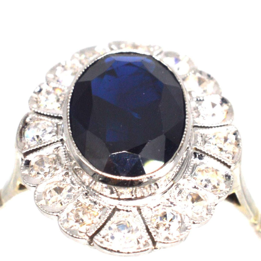 Early 20th Century Dark Blue Sapphire and Diamond Cluster Ring