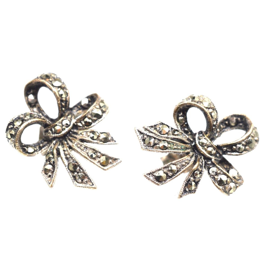 Edwardian silver marcasite bow earrings showcasing vintage elegance and intricate design.