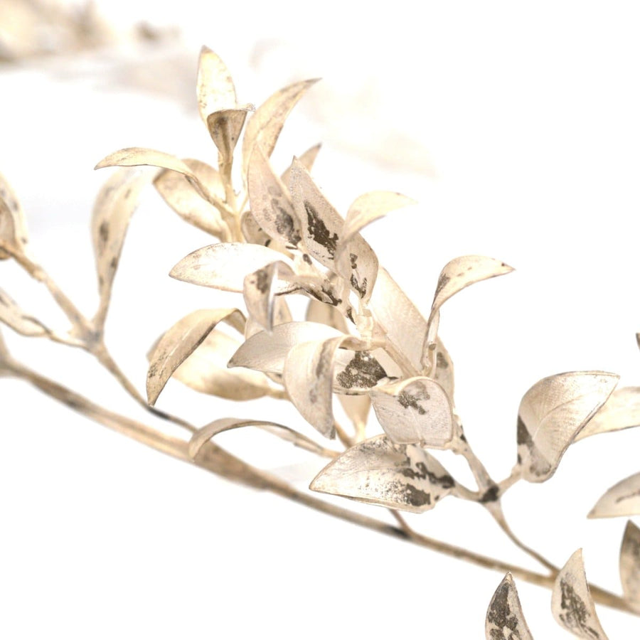 Close-up of silver myrtle leaves from a Victorian marriage tiara, symbolizing love and marriage.