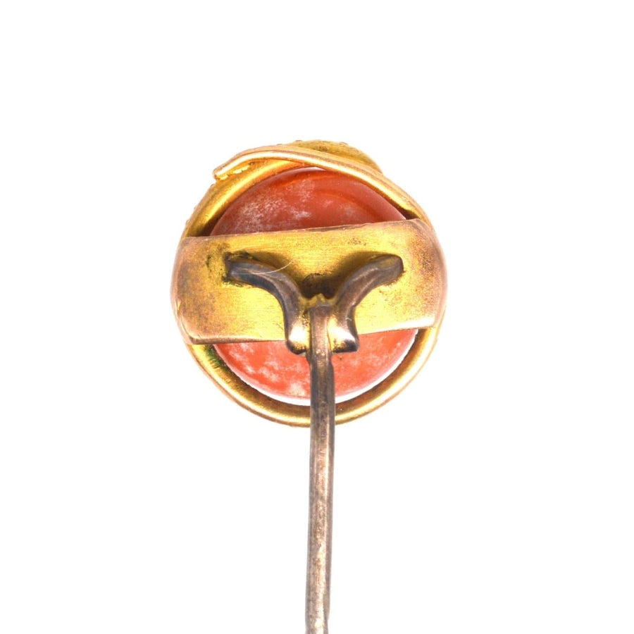 Victorian 15ct gold snake tie pin featuring a coral bead, symbolizing everlasting love and wisdom.