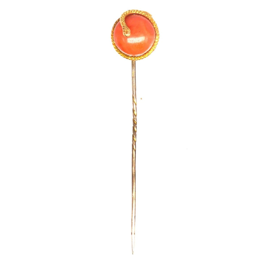 Victorian 15ct gold snake tie pin with coral bead, symbolizing everlasting love and protection.