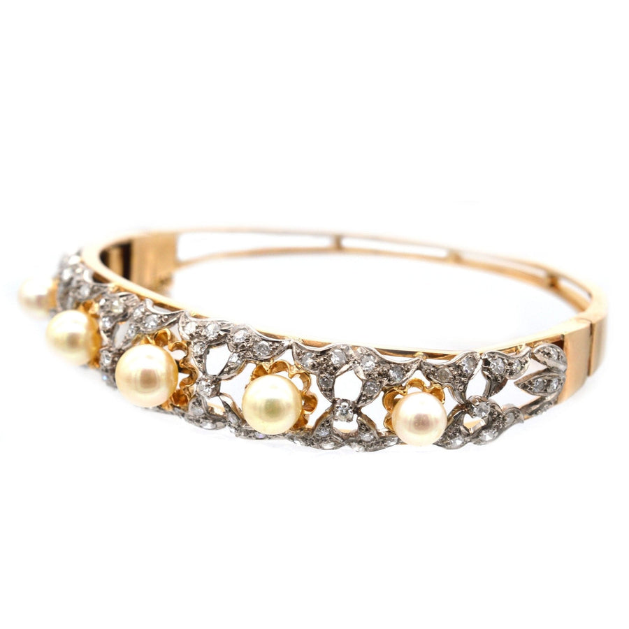 1940s 18ct gold bangle featuring cultured pearls and diamonds, showcasing a unique and elegant design.