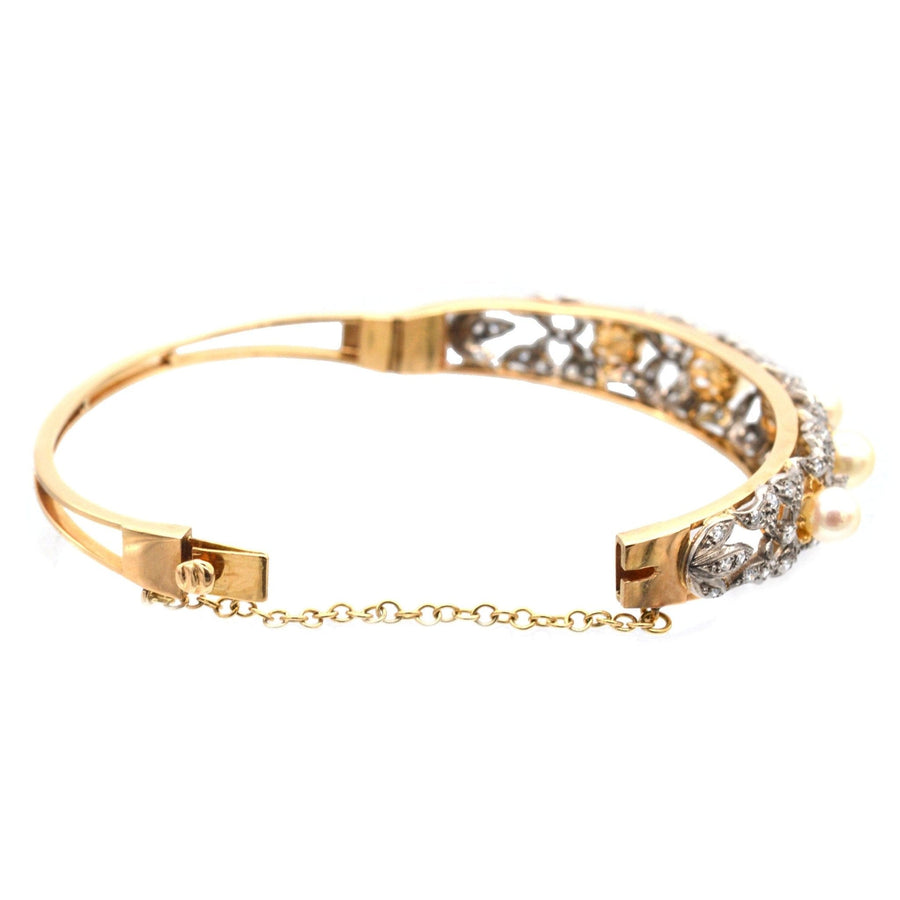 1940s 18ct gold bangle featuring cultured pearls and diamond trellis-work, perfect for any jewelry collection.