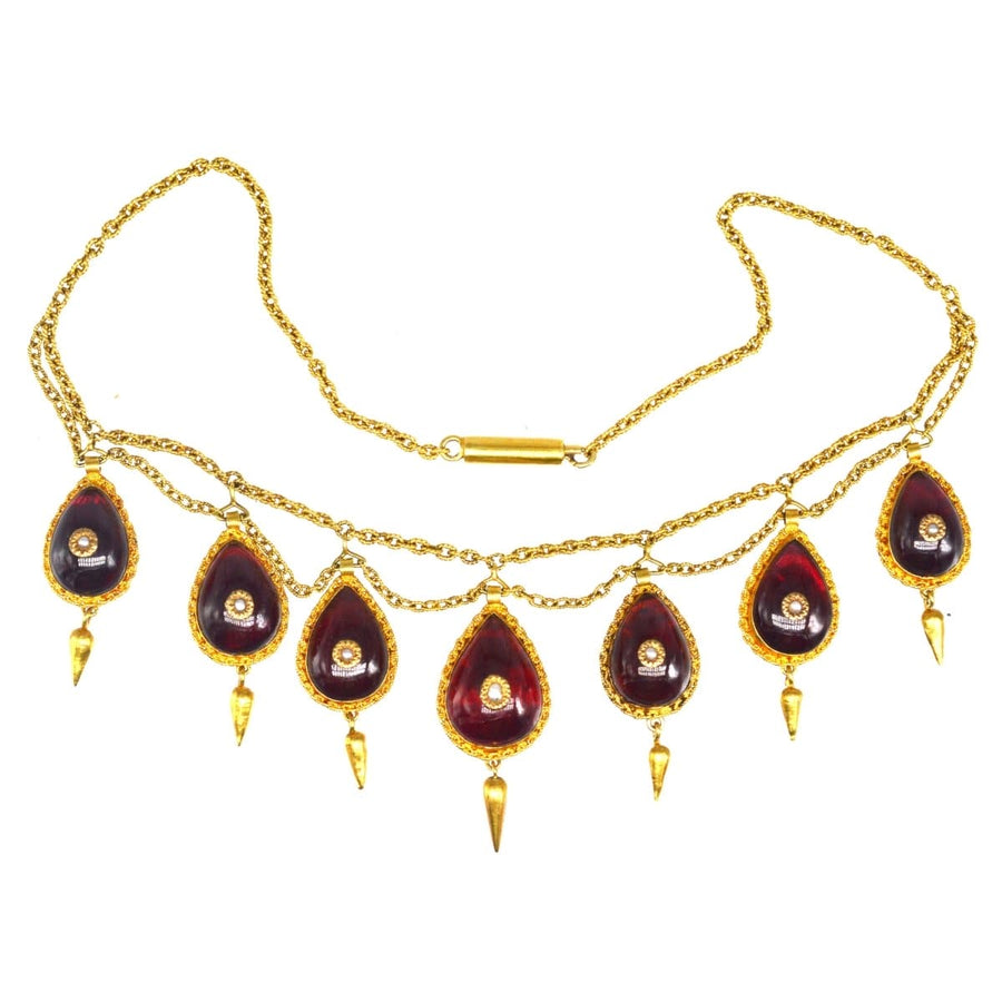 19th century gold swag chain necklace with garnets and seed pearls, elegant vintage jewelry piece from the 1870s.