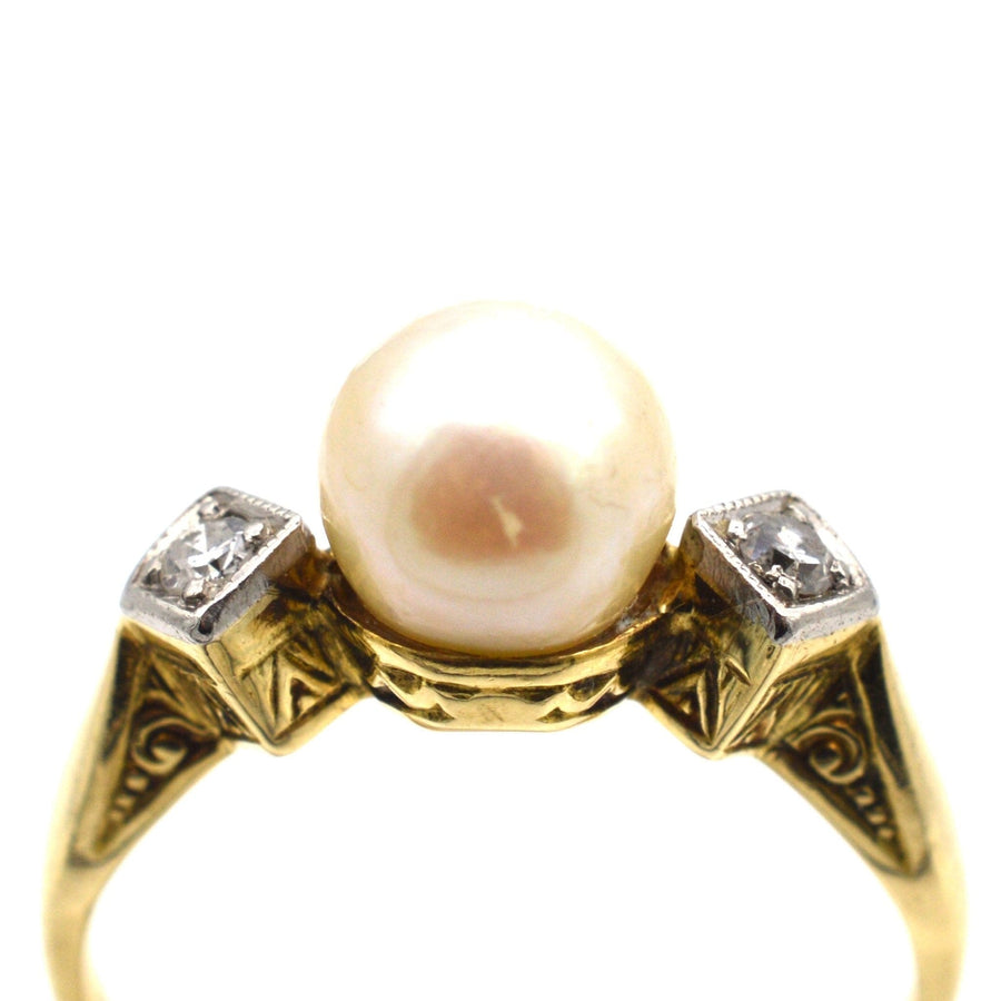 Art Deco 14ct gold ring featuring a cultured pearl and two diamonds, crafted in the 1930s, perfect as an engagement ring.
