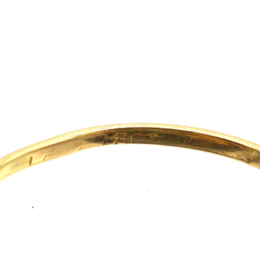 Interior view of an 18ct gold ring, showcasing the craftsmanship and metal quality.