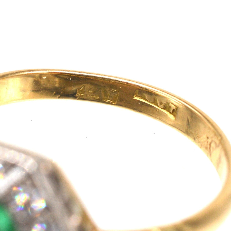 Close-up of the inner band of an Art Deco gold and platinum ring showcasing hallmark details.