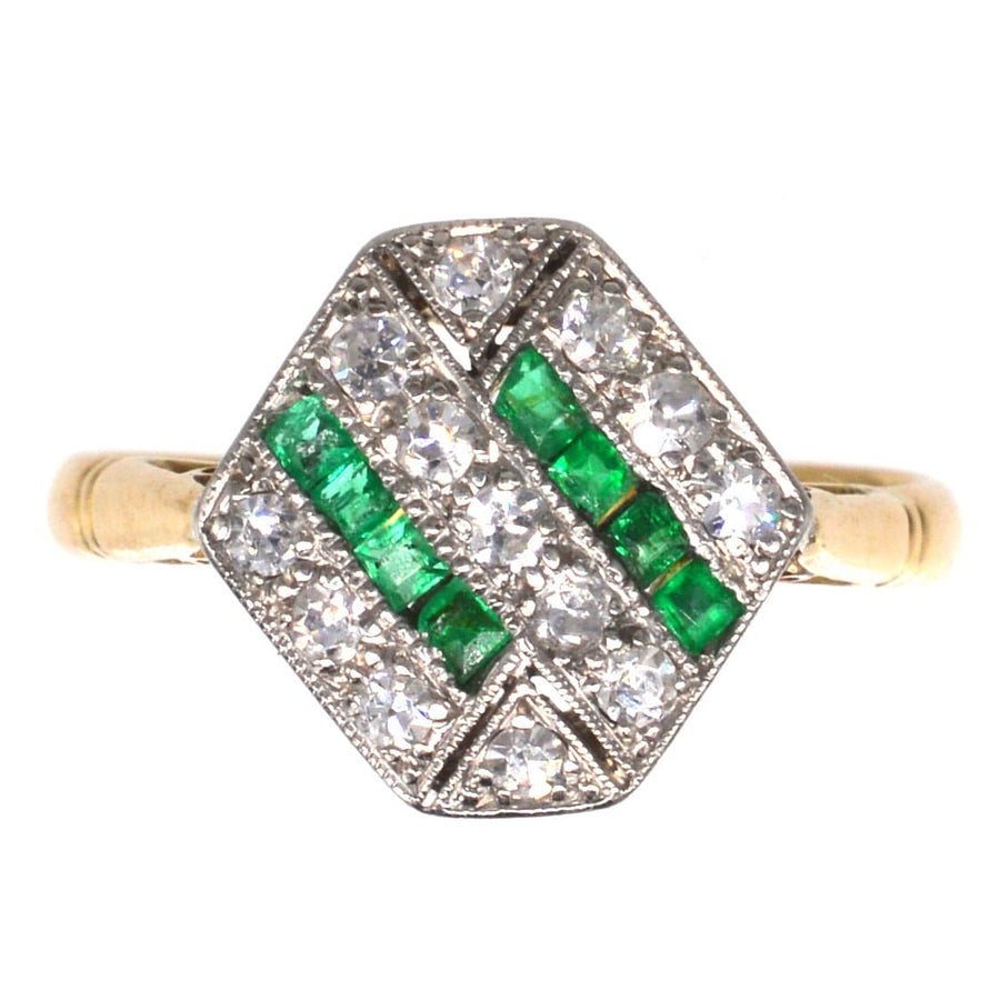 Art Deco 18ct gold & platinum hexagonal ring featuring emeralds and diamonds in a geometric design.