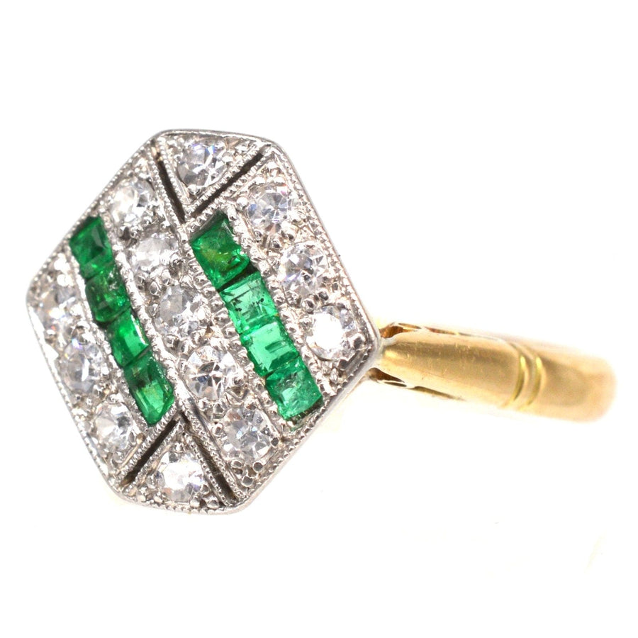 Art Deco 18ct gold and platinum hexagonal ring featuring emeralds and diamonds, showcasing geometric design.