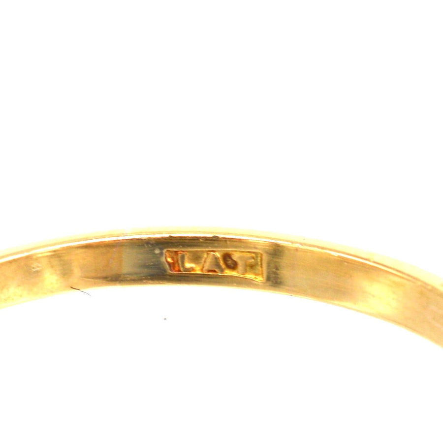 Close-up of gold hallmark on the inside band of a vintage ring by S Blanckensee & Son Ltd.