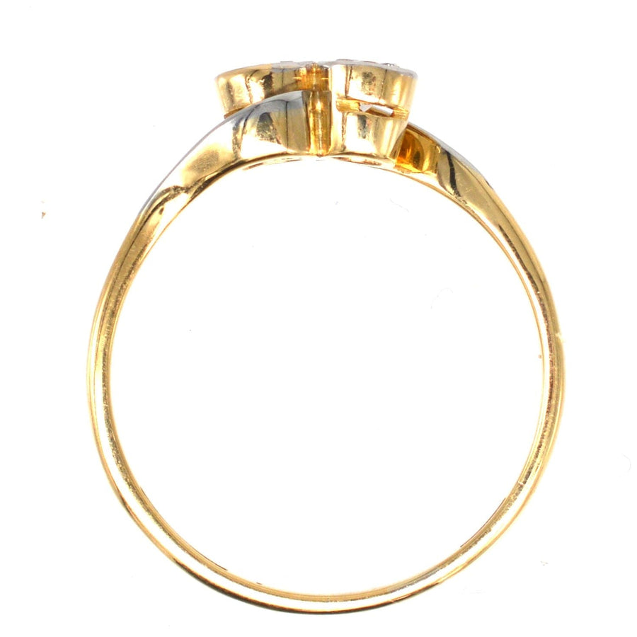 Art Deco 18ct gold and platinum two-stone diamond 'Toi et Moi' crossover ring, elegant design.