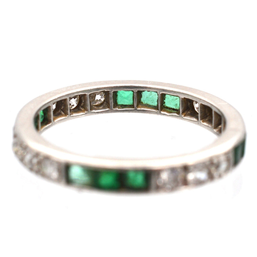 Art Deco 18ct white gold emerald and diamond eternity ring, showcasing a dazzling design and vibrant stones.