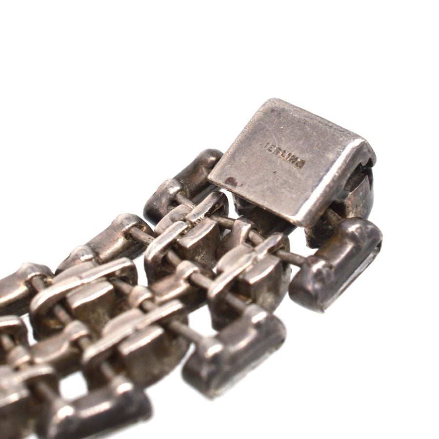 Close-up of an Art Deco silver paste choker necklace showcasing intricate craftsmanship and clasp design.
