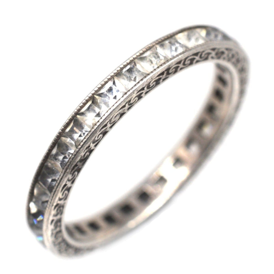 Art Deco silver paste eternity ring featuring sparkling stones, a symbol of everlasting love and perfect for engagements or weddings.