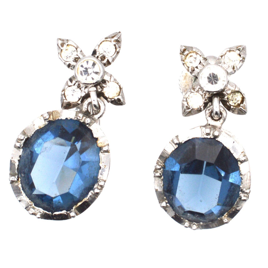 Art Deco earrings with blue paste stones, intricate diamond paste tops, elegant vintage jewelry.
