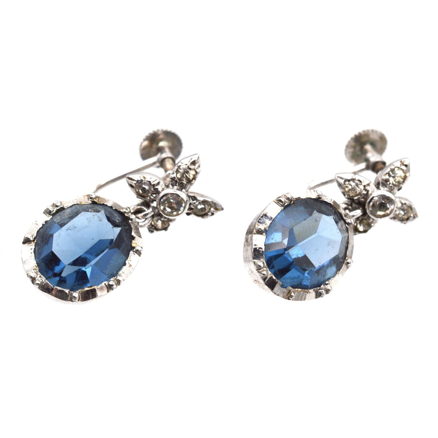 Art Deco silver earrings featuring inky blue paste stones and intricate diamond paste tops.