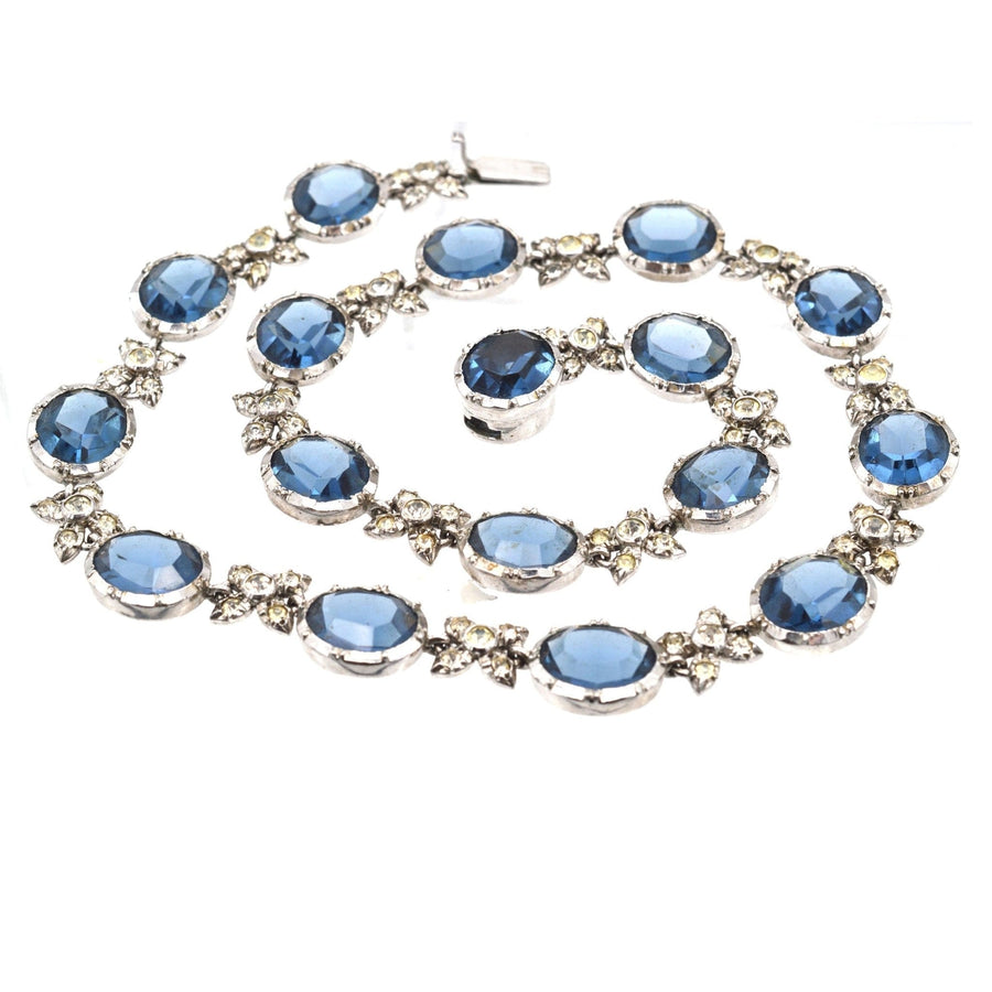Art Deco silver necklace featuring blue sapphire pastes and diamond paste links, capturing vintage elegance.