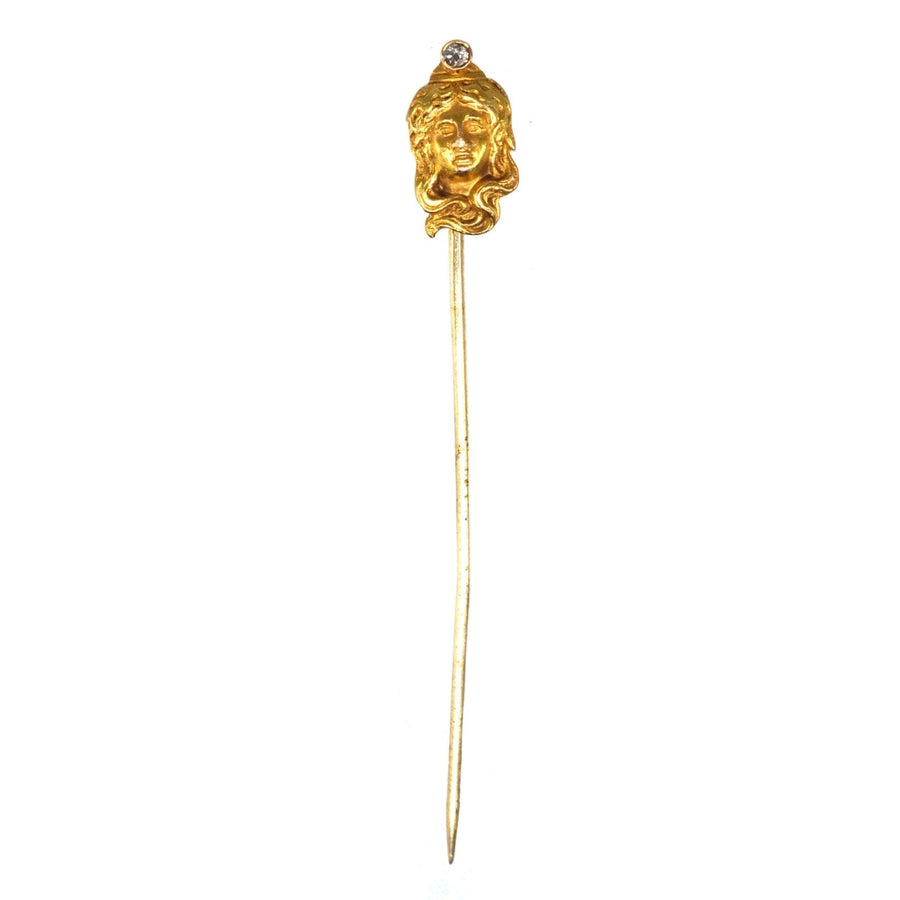 Art Nouveau 15ct gold portrait pin of a lady adorned with a diamond, showcasing natural curves and exquisite craftsmanship.