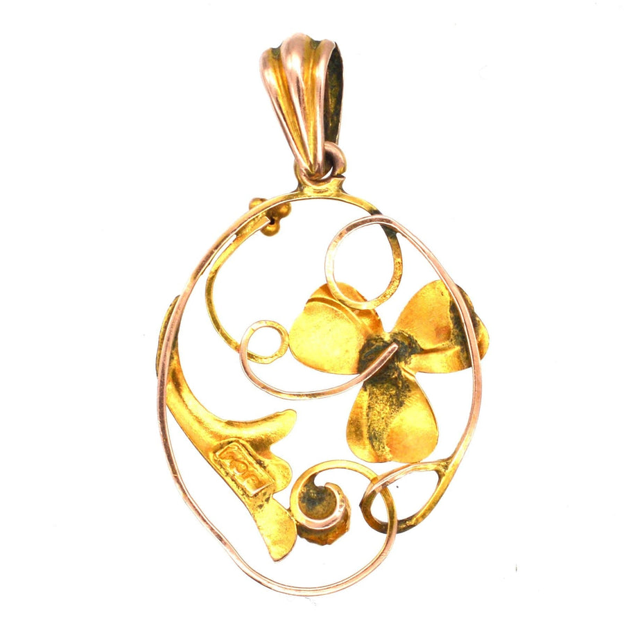Art Nouveau 9ct gold floral pendant featuring a flower design and a sapphire, perfect gift for a young lady.
