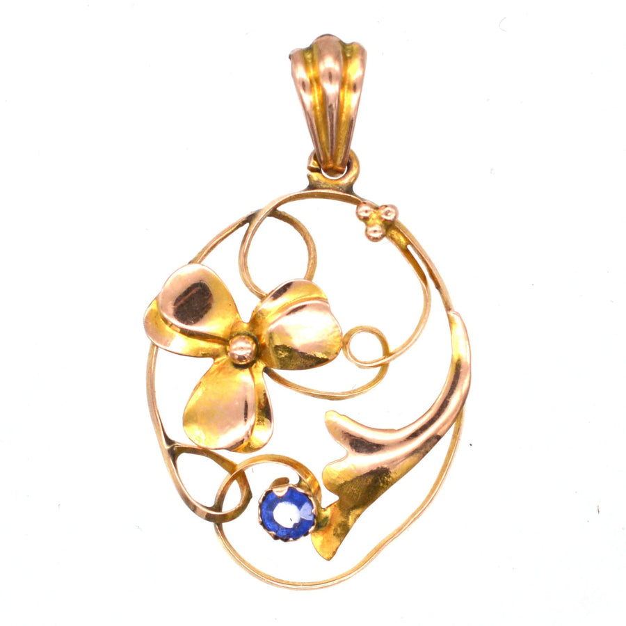 Art Nouveau 9ct gold floral pendant featuring a flower design and sapphire, ideal gift for young ladies.