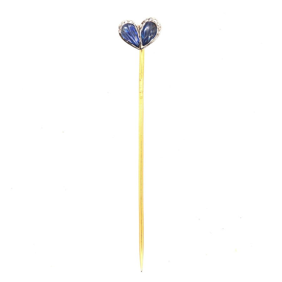 Belle Époque heart pin featuring carved sapphires and diamonds, ideal for ties or lapels.