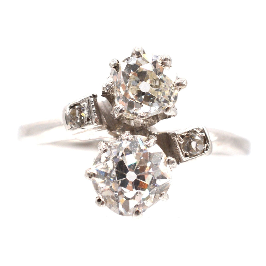 Belle Époque platinum and diamond 'Toi et Moi' crossover ring featuring two stunning diamonds.