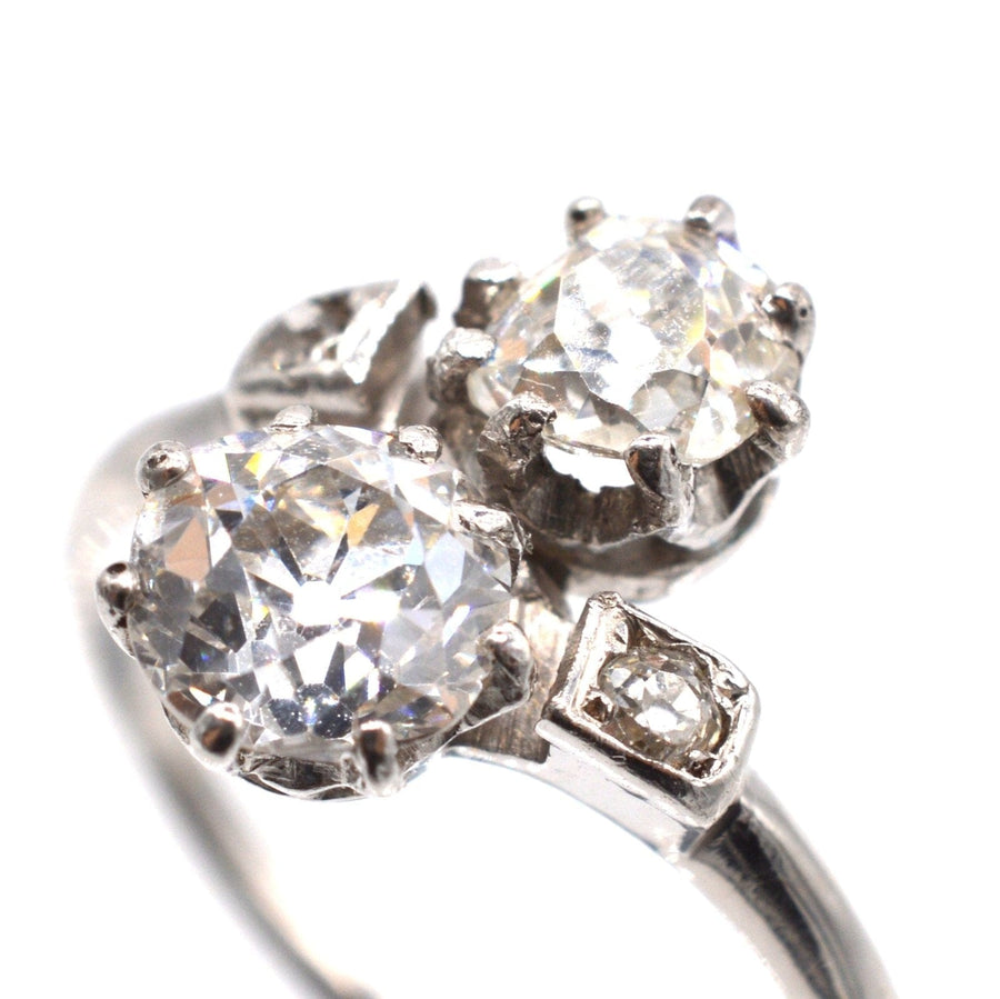 Belle Époque platinum diamond 'Toi et Moi' crossover ring featuring two stunning diamonds.