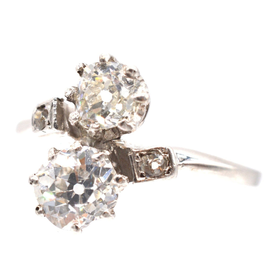 Belle Époque platinum and diamond 'Toi et Moi' crossover ring featuring two stunning diamonds.