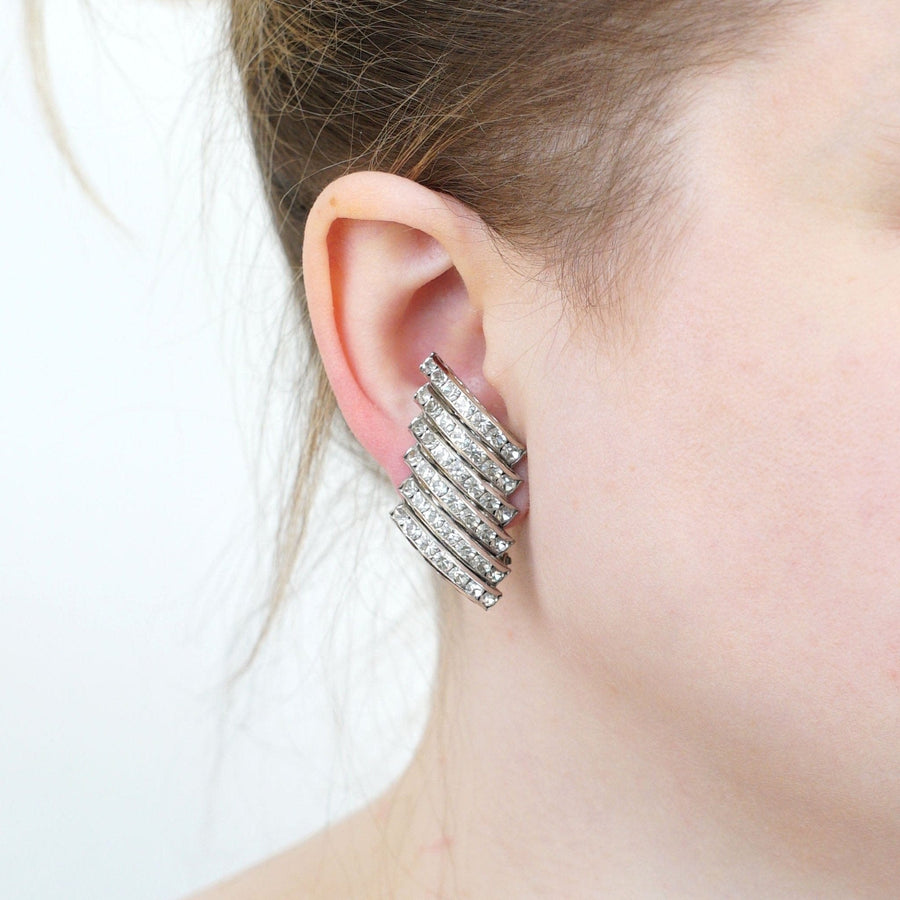 Butler and Wilson 1980s silver-tone wide crystal diamante earrings worn by model, showcasing luxurious sparkle.
