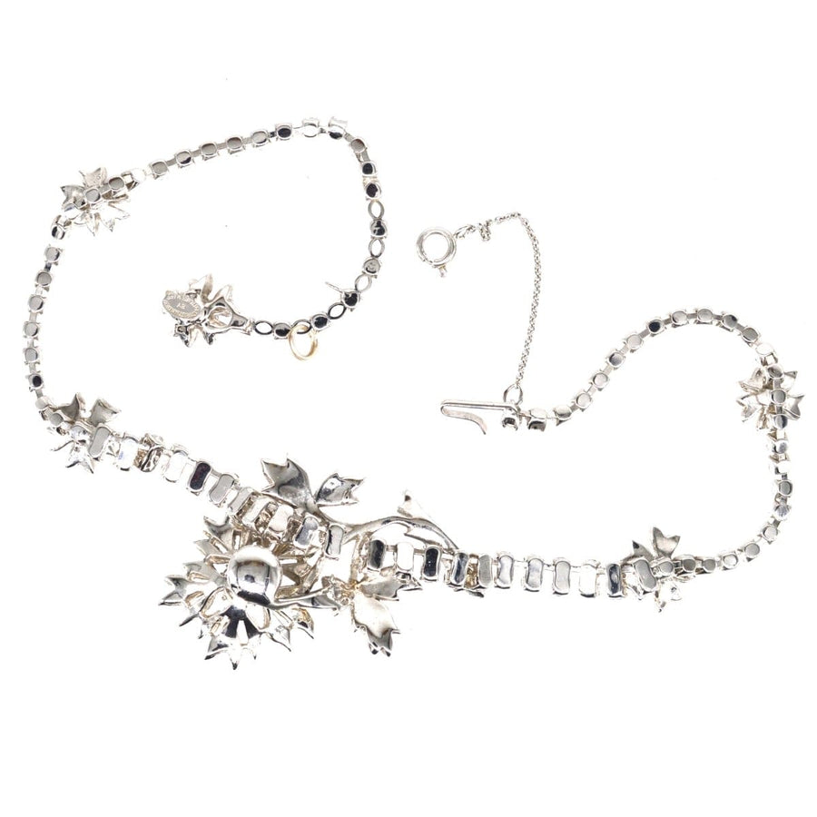 Christian Dior 1950s 'En Tremblant' necklace with white paste stones and rhodium plating, elegant floral design.
