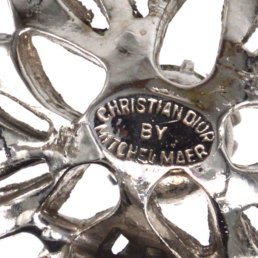Close-up of the signature on Christian Dior by Mitchel Maer 1950s flower earrings, showcasing the intricate design.