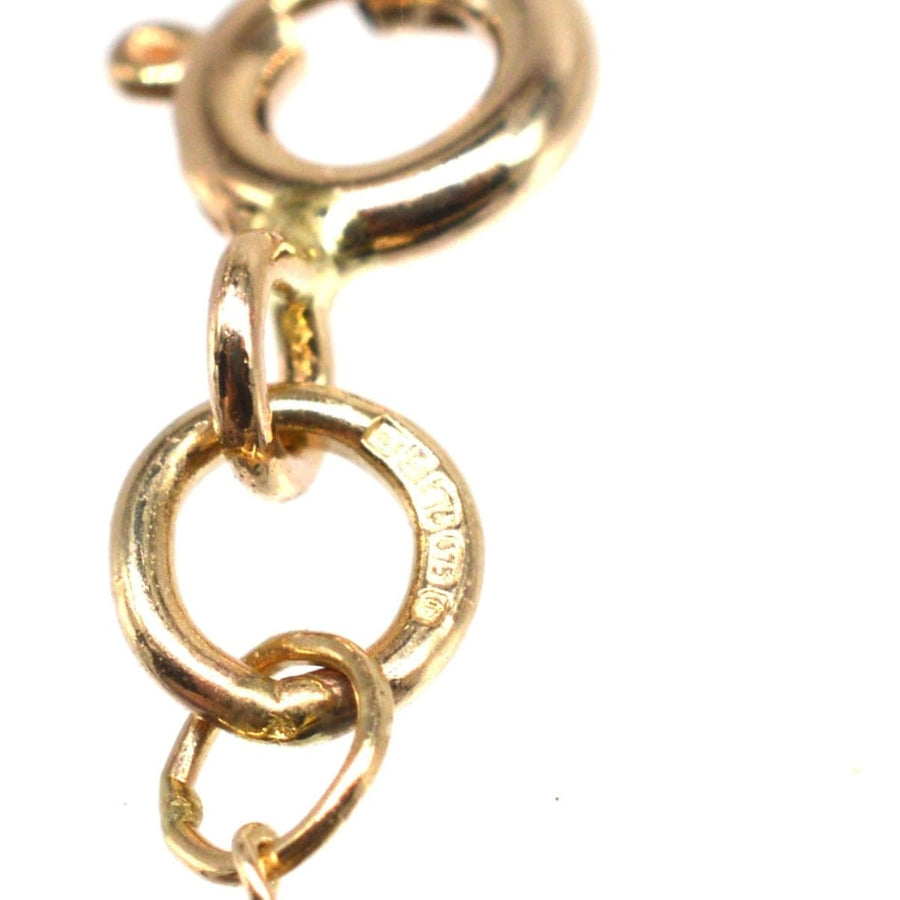 Close-up of a 9ct gold curb chain link showcasing fine polish and detailed craftsmanship.