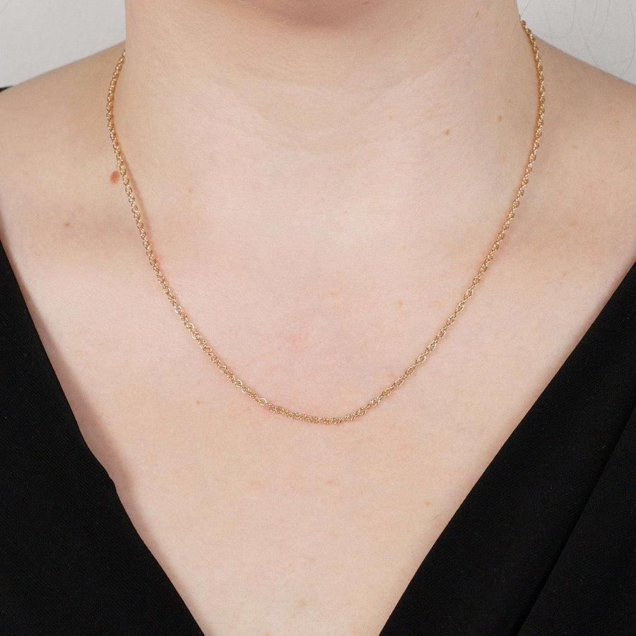 Contemporary 9ct rose gold Prince of Wales rope chain worn, showcasing its polished finish and elegant design.