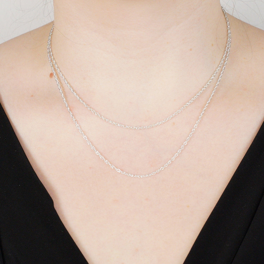 Silver Prince of Wales Rope Chain, 18 inches long, 1.9mm wide, elegantly layered on model's neck.
