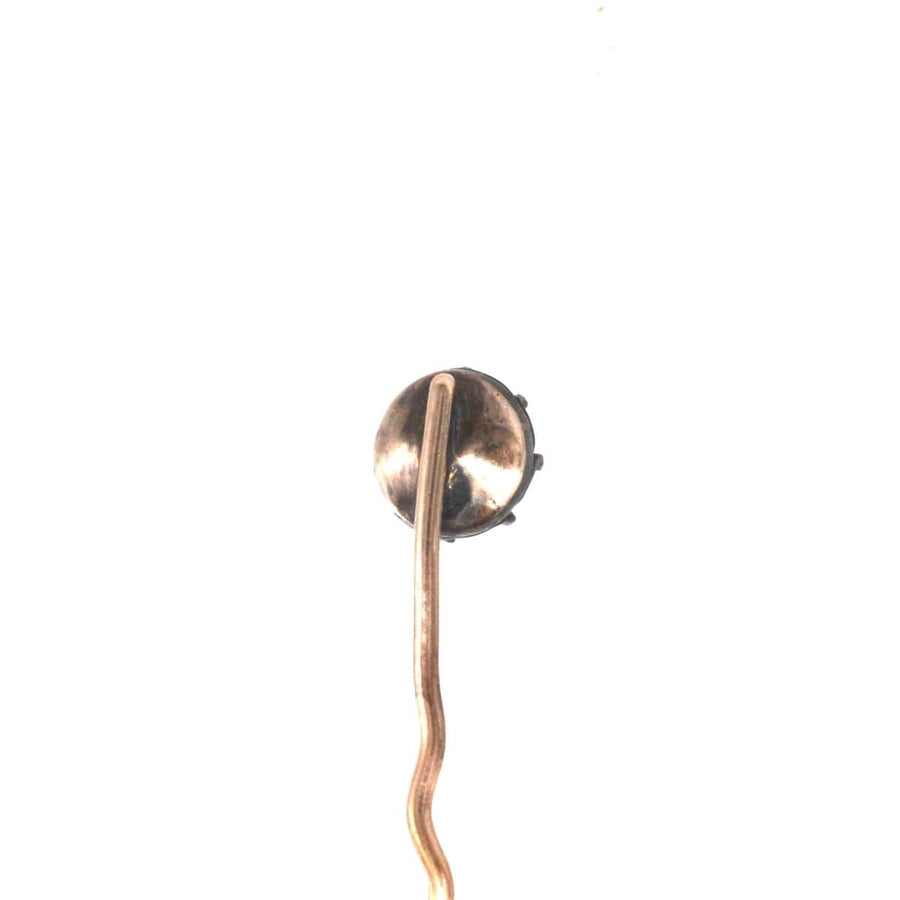 Close-up of an early 19th Century silver rose cut paste tie pin, showcasing its elegant design.