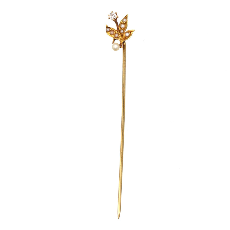 Edwardian 14ct gold tie pin featuring natural pearl leaves and a diamond flower design from the 1900s.