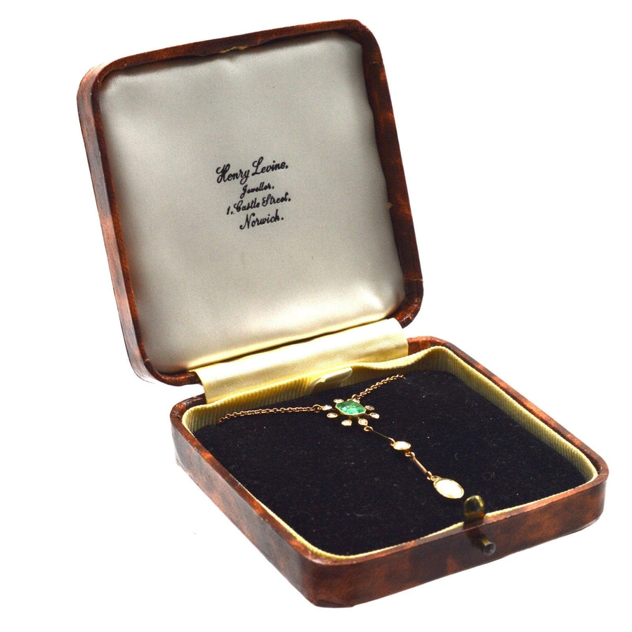 Edwardian gold emerald and diamond pendant in original Henry Lewis box.