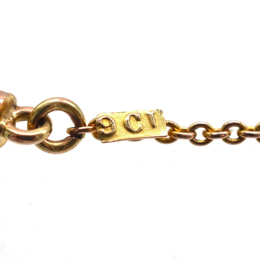 Close-up of a 9ct gold chain with hallmark, showcasing fine Edwardian jewelry craftsmanship.