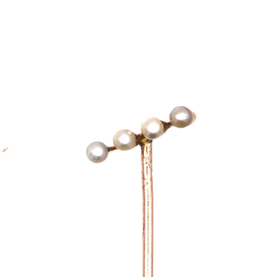 Edwardian 15ct gold tie pin featuring four natural pearls on a diagonal bar for a stylish and elegant look.
