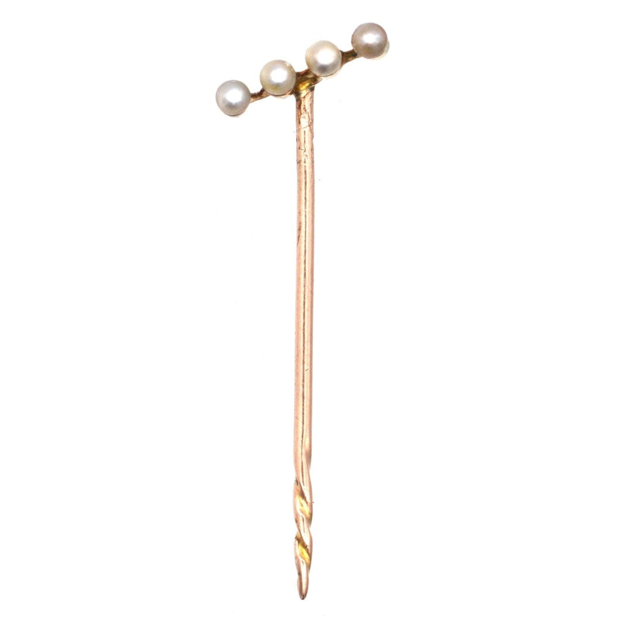 Edwardian 15ct gold tie pin featuring four natural pearls on a diagonal bar, perfect for a stylish silk tie.