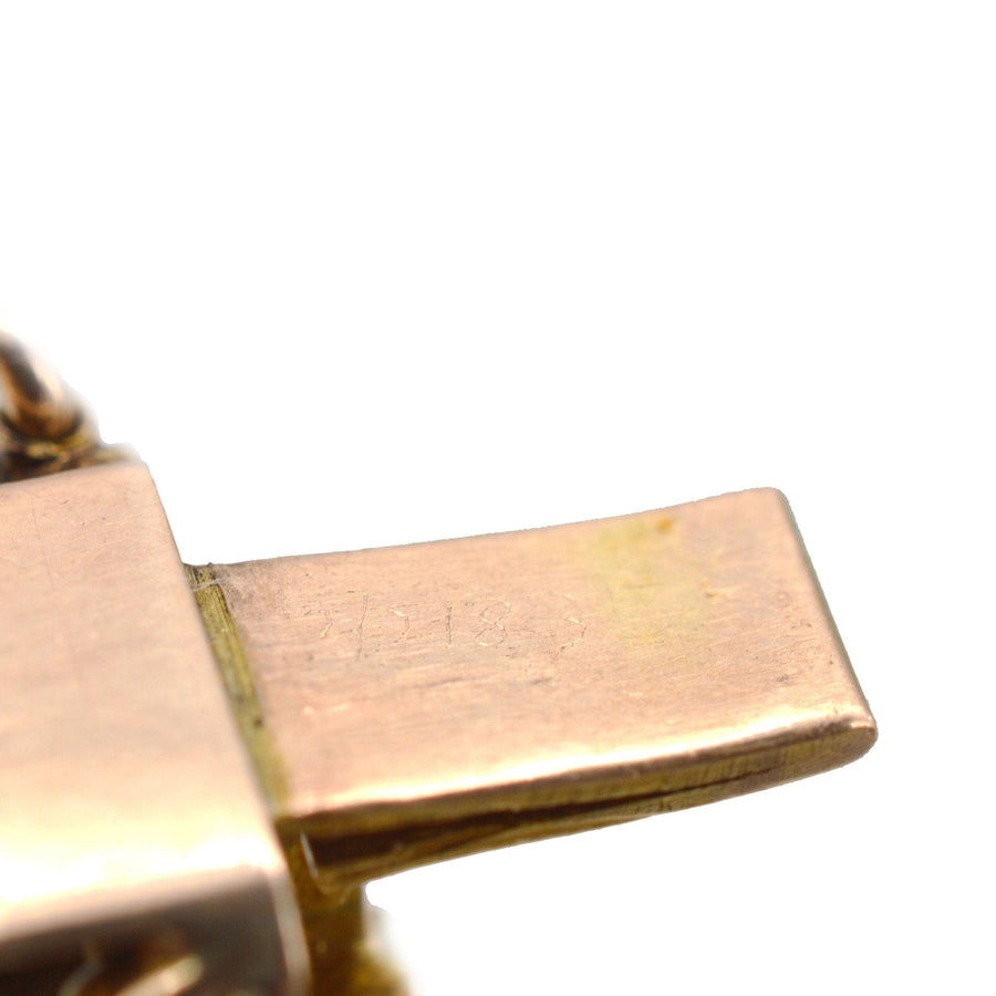 Close-up of clasp detail on Edwardian 15ct gold gate bracelet with turquoise, showcasing vintage craftsmanship.