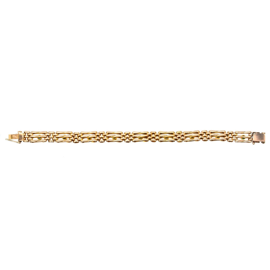 Edwardian 15ct gold gate bracelet featuring intricate links, timeless design, elegant for any occasion.