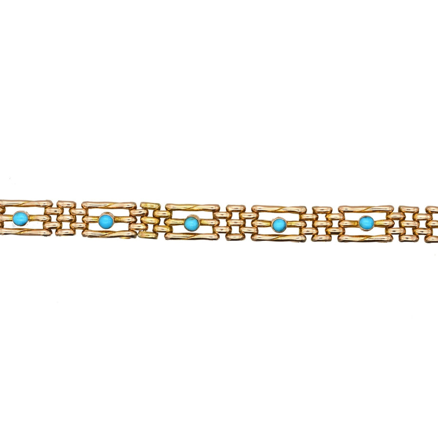 Edwardian 15ct gold gate bracelet featuring turquoise stones, elegant and timeless design for any occasion.