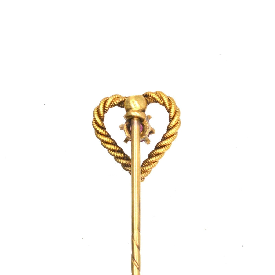 Edwardian 15ct gold knot heart tie pin featuring a natural ruby, perfect for formal occasions and special gifts.