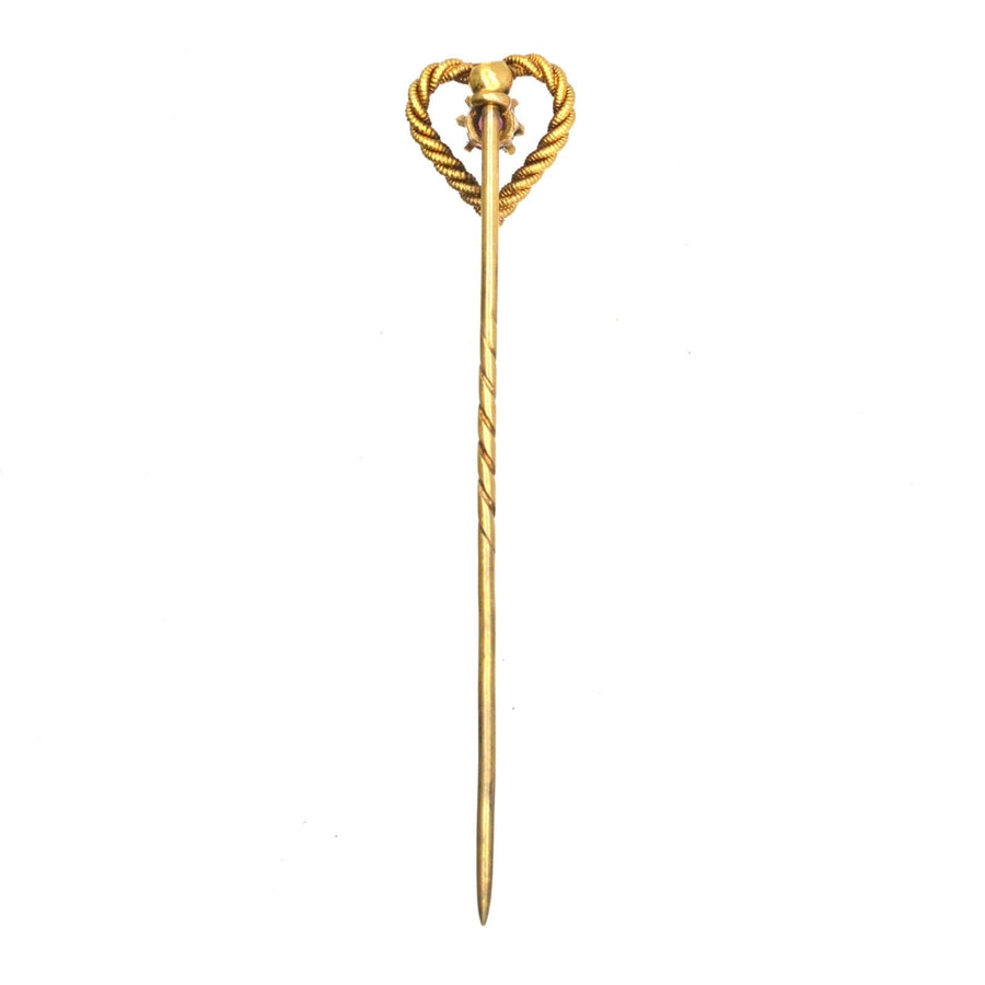 Elegant Edwardian 15ct gold knot heart tie pin featuring a natural ruby, perfect for special occasions or gifts.